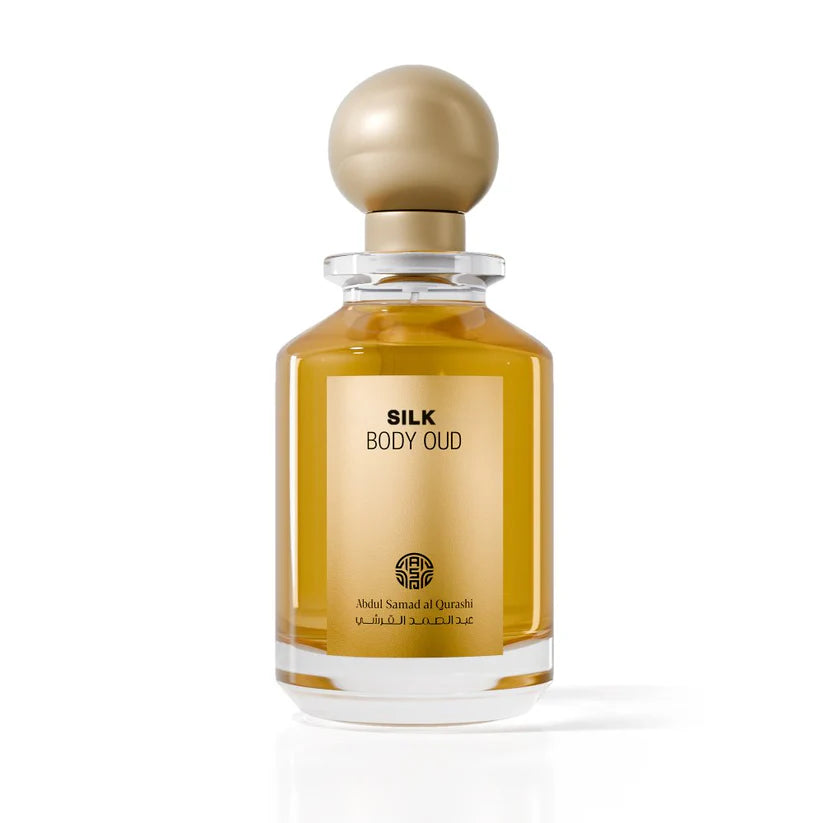 Abdul Samad Al Qurashi Silk Body Oud perfume bottle with a round gold topper.