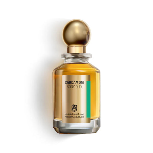 Abdul Samad Al Qurashi Cardamom Body Oud 100ml parfum bottle filled with golden amber liquid, featuring a metallic gold spherical cap against a white background.