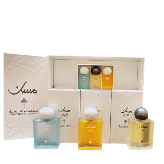 Ibraheem Al Qurashi Musk Collection perfume set featuring three bottles and branded white display boxes.