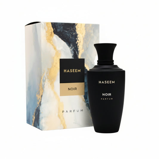 Naseem Noir perfume bottle and matching marble-design product box on a white background.